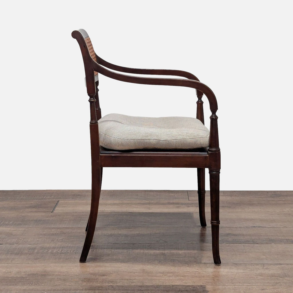 2. Side view of a Reperch mahogany chair featuring a cane back and thick removable cushion.  