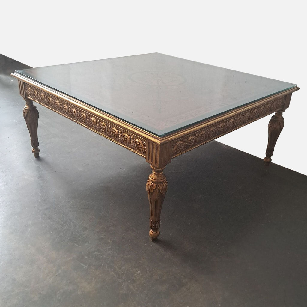 2. Square antique-style coffee table by Reperch featuring gilded legs, ornate carvings, and glass protection.