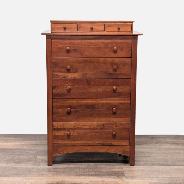 Front view of a traditional Ethan Allen cherry wood dresser with dovetail joints and matching wood knobs.