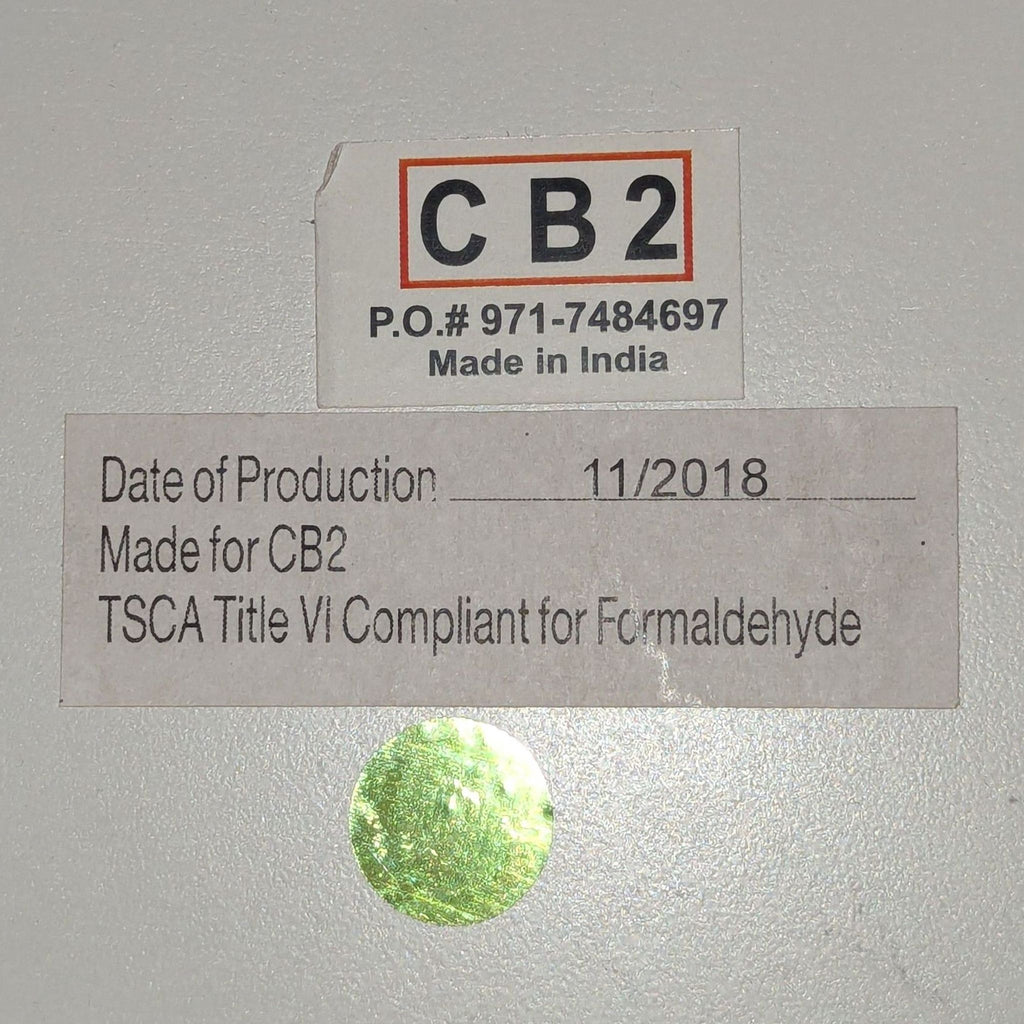 3. Manufacturer label for CB2 end table, showing "Made in India" and formaldehyde compliance.