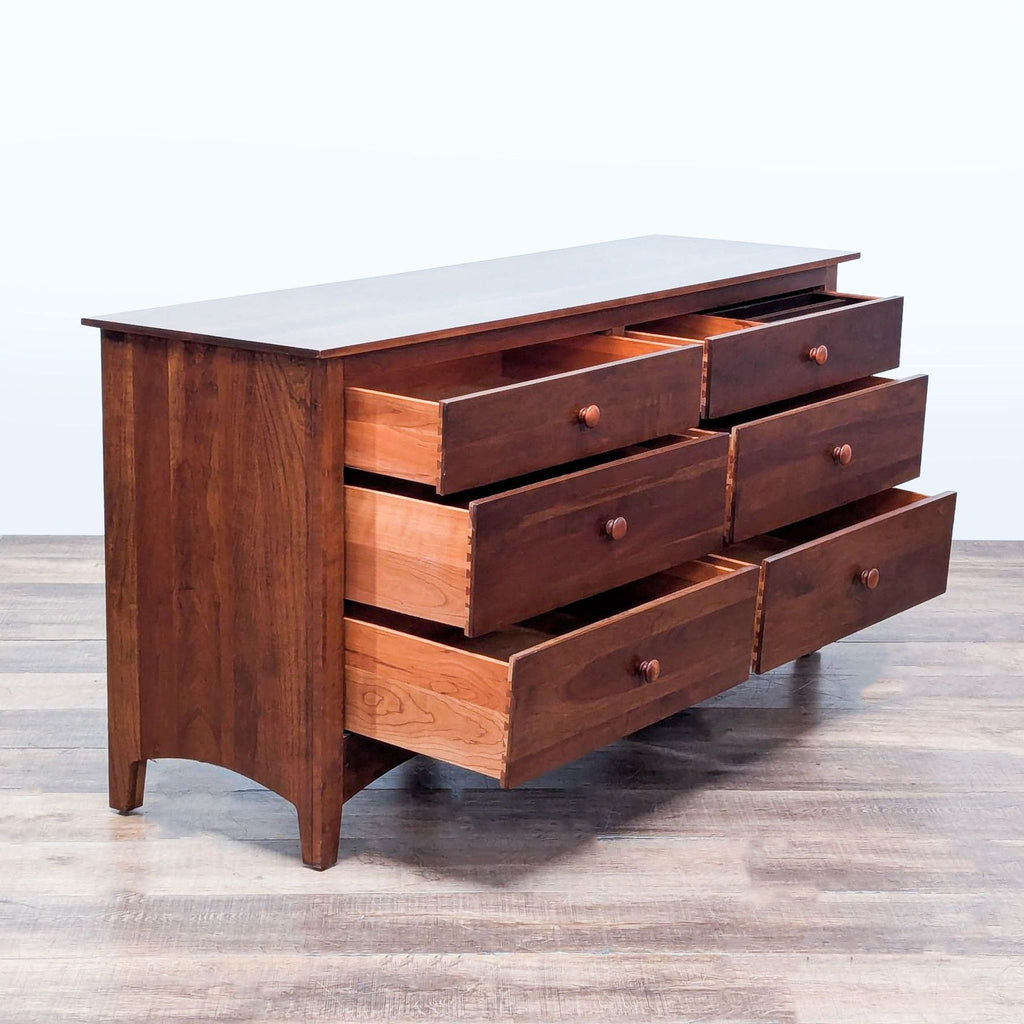 2. Open view of Ethan Allen cherry dresser, highlighting dovetailed drawers and turned knobs in Arts & Crafts style.