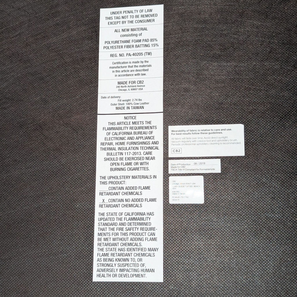 3. Product tag for CB2 bench, detailing materials, care instructions, and compliance information.