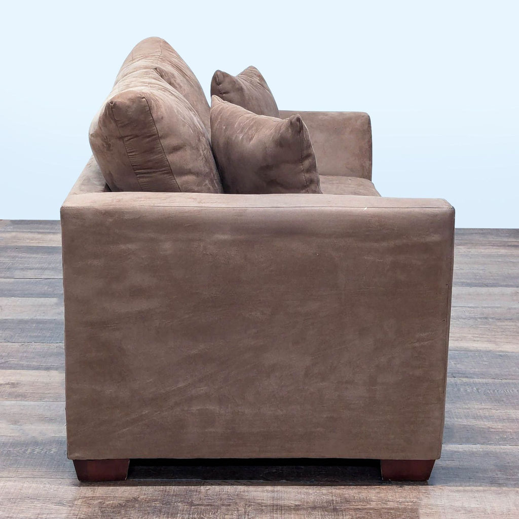 2. Side view of Reperch Loveseat highlights its angled track arm design and plush microfiber removable cushions.  