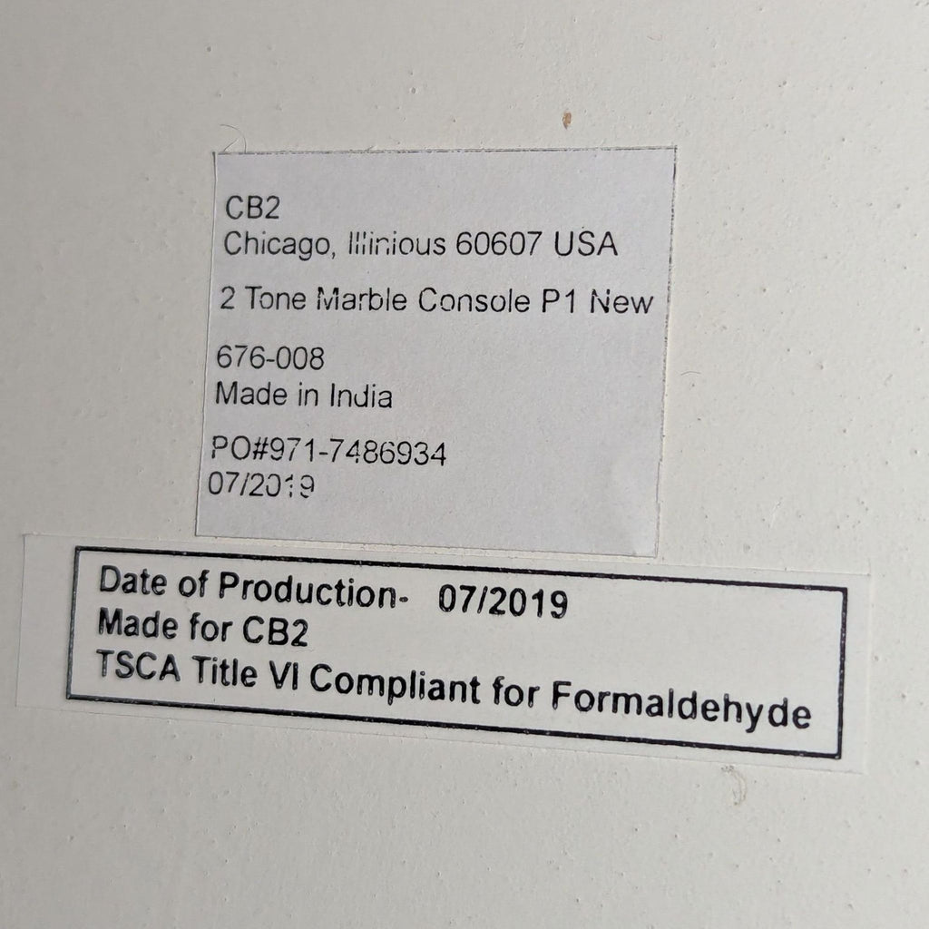 2. Product label showing CB2 brand, 2 Tone Marble Console, produced 07/2019, TSCA compliant, made in India.