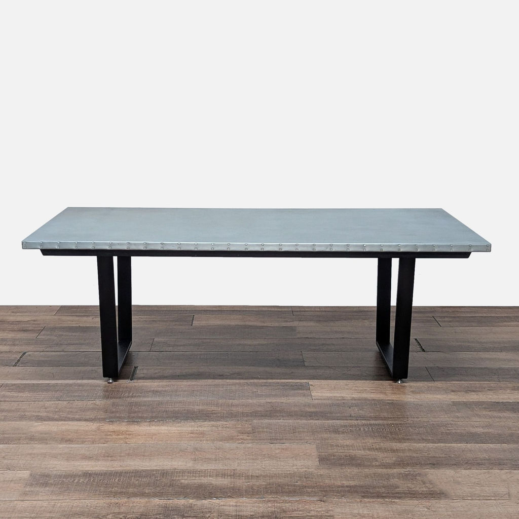 2. Kingston Krafts rectangular dining table with steel base and zinc top, shown alone on wood floor.  