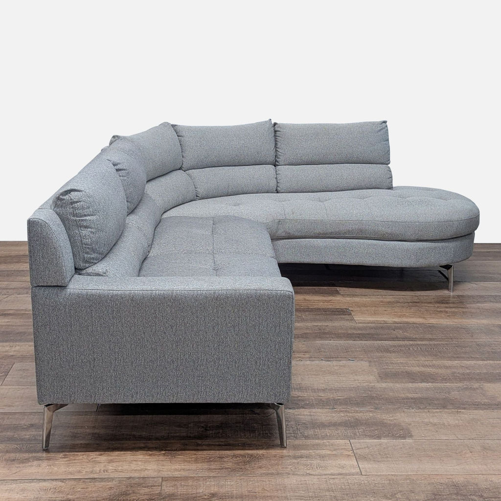 2. Contemporary gray sectional sofa by Homeglance featuring rounded backs, tufted seats, and chrome legs.