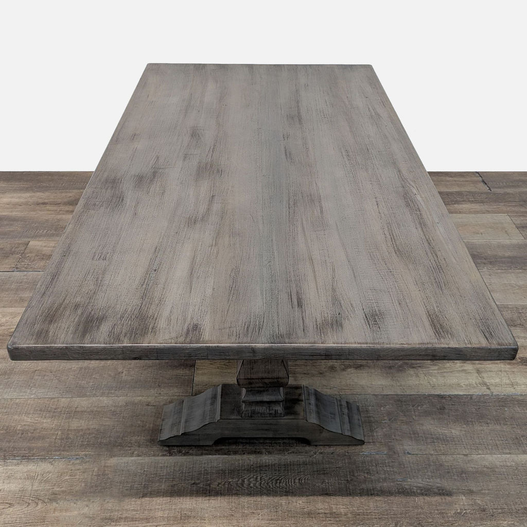 2. Close-up view of the Bassett solid maple farmhouse style dining table with a pedestal base.  