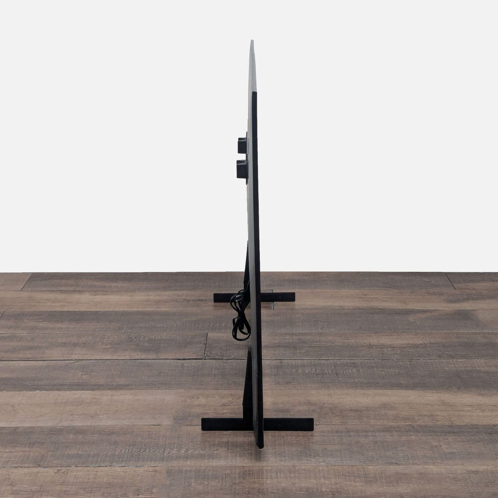 Side profile of Samsung 65-inch 4K UHD TV, highlighting its ultra-slim design and minimalist black stand.