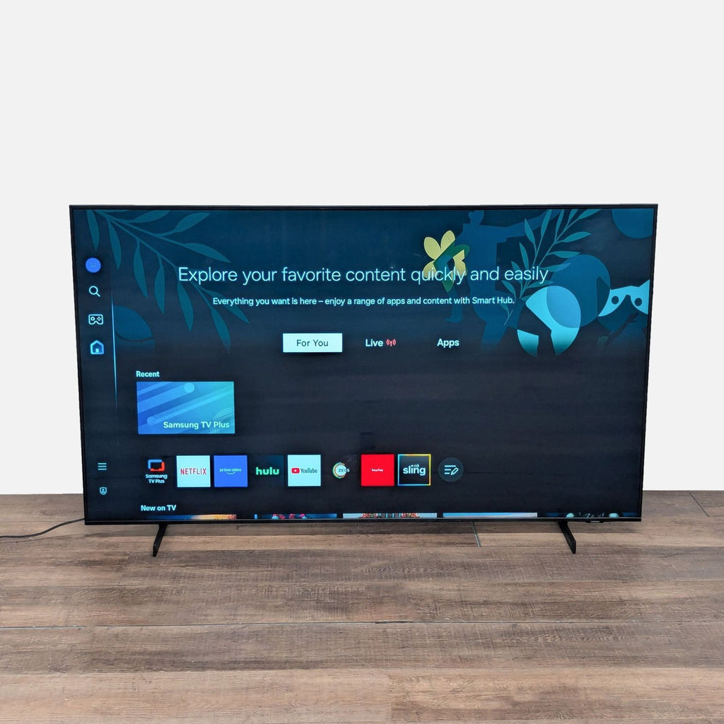 Samsung 65-inch 4K UHD Smart TV with popular apps on screen, slim design, and vibrant display, front view.  