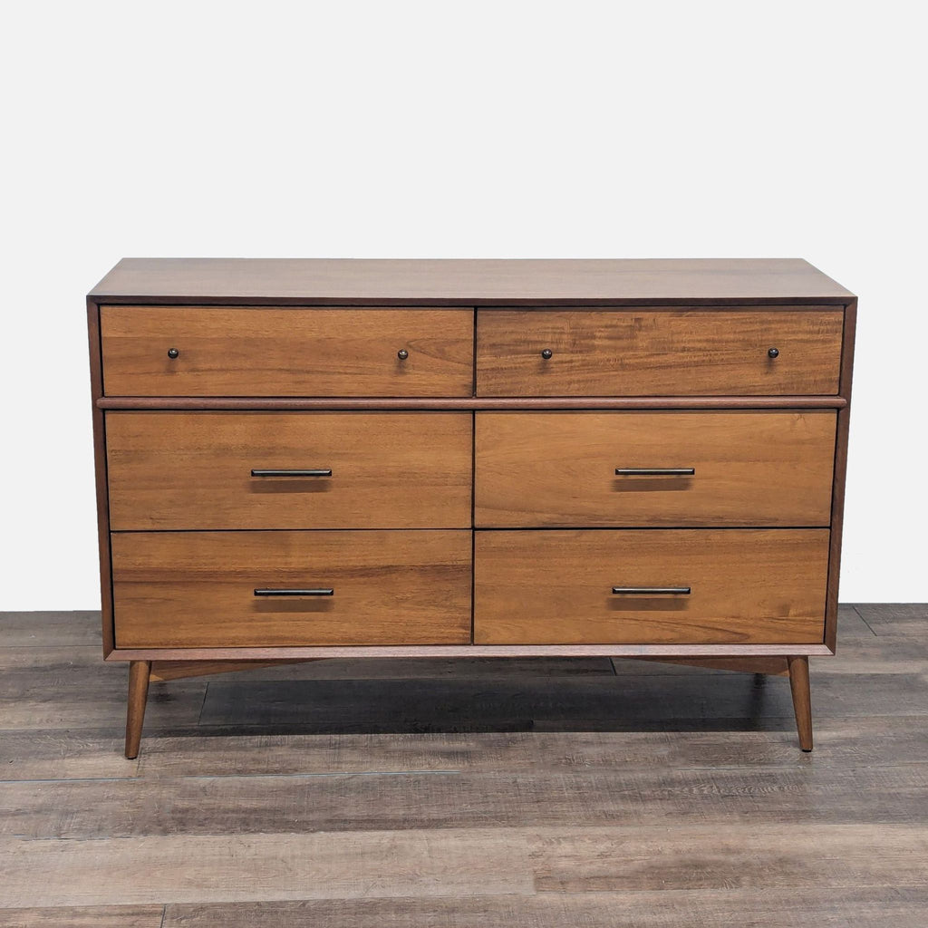 1. West Elm dresser with a mid-century design, tapered legs, and beveled edges, featuring six spacious drawers.