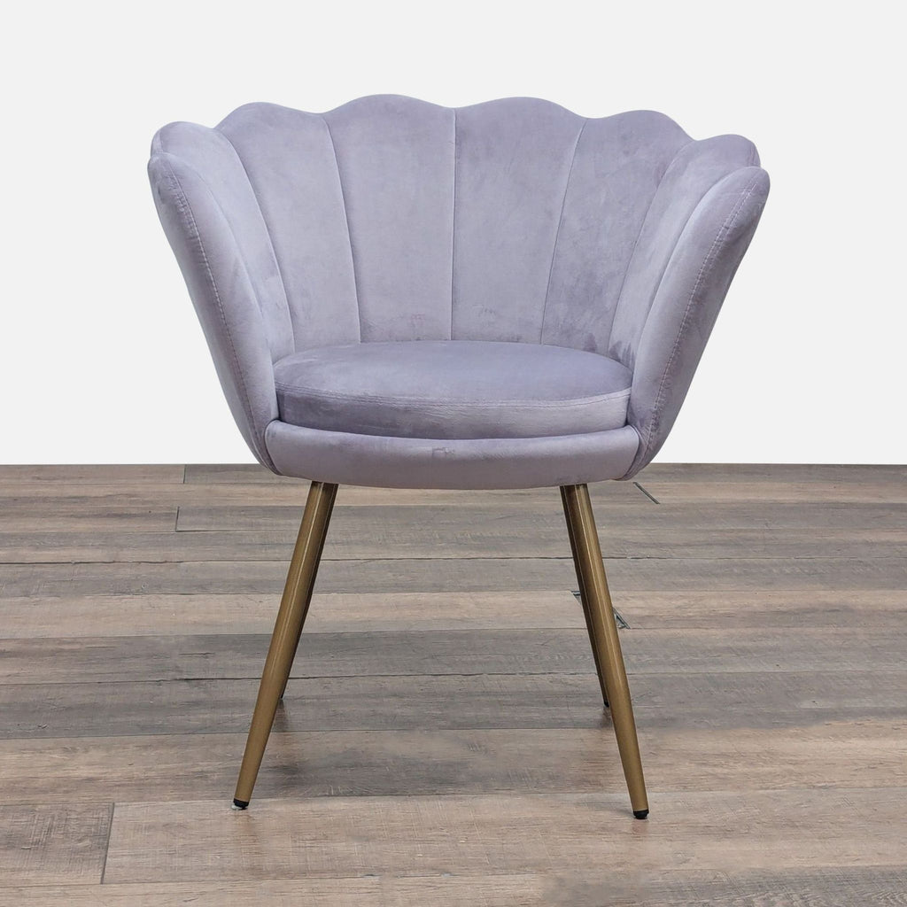 Front view of a velvet lounge chair by Abble with seashell edges, vertical tufting, and gold metal legs.