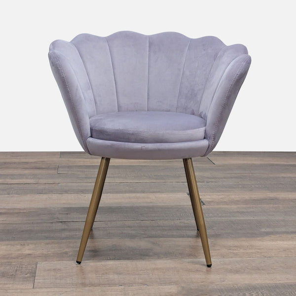 Front view of a velvet lounge chair by Abble with seashell edges, vertical tufting, and gold metal legs.
