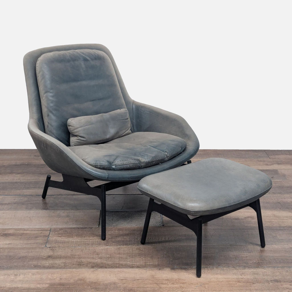 1. Modern Blu Dot lounge chair with matching ottoman, featuring soft upholstery and sculptural black base, front view.