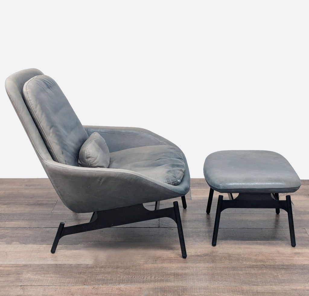 2. Side profile of Blu Dot lounge chair and ottoman, showing roomy seat, sleek silhouette, and comfortable pitch.
