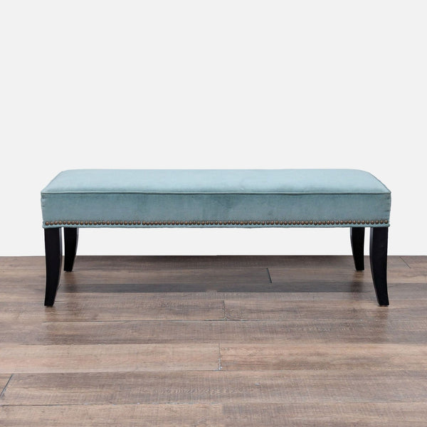 1. Upholstered bench with soft natural linen blend, brushed pewter nailheads, and flared dark wood legs.