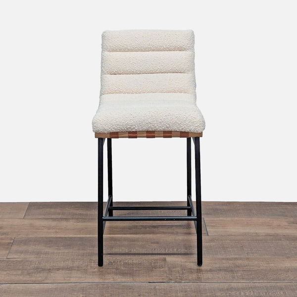 1. Front view of a channel tufted boucle stool with Cognac PU leather accents and black iron legs by Lilola Home.  