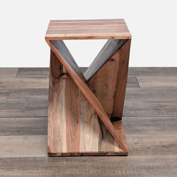 Wooden Reperch side table with geometric X-shaped base, shown on a wood floor, category: Side & Console Table.