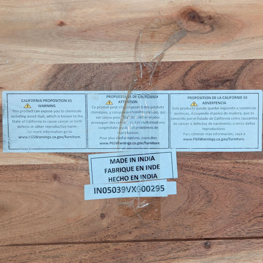Label on the underside of a Reperch side table displaying California Proposition 65 warning and “Made in India.”
