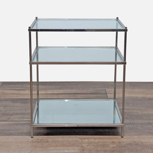 1. Crate and Barrel end table with metal frame, two glass shelves, and a mirrored bottom shelf, modern design.  