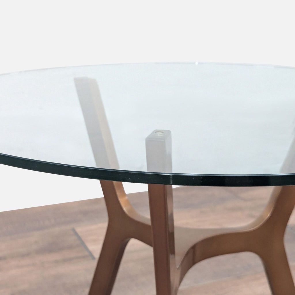 3. Close-up of Crate and Barrel end table’s edge, highlighting the thick glass top and brass base connection.