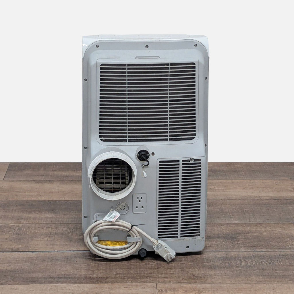 3. Rear view of Whynter portable air conditioner showing vents, power cord, and dual hose connection points.