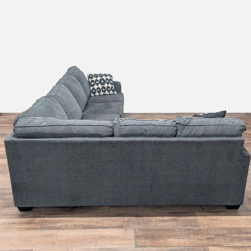 Ashley Furniture Dark Gray Sectional Sofa with Accent Pillows