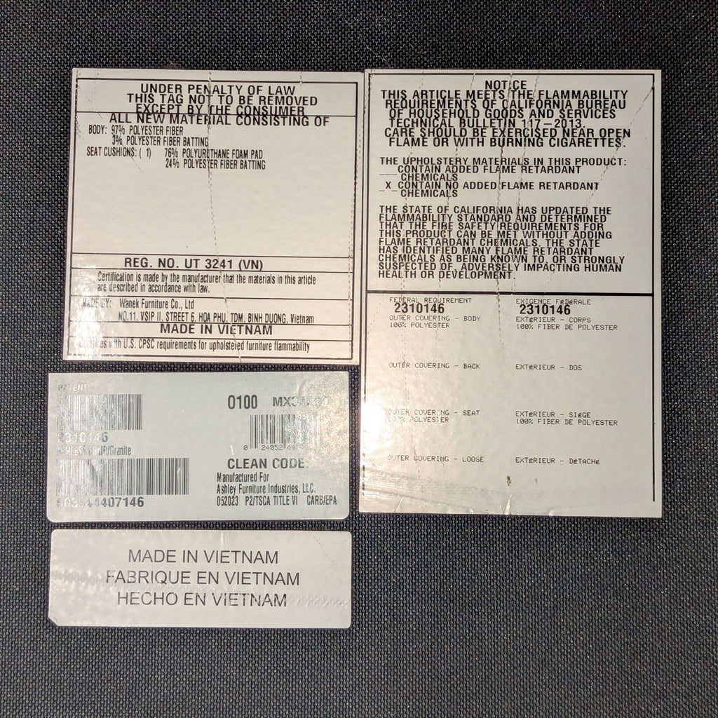 Ashley Furniture Dark Gray Sectional Sofa with Accent Pillows