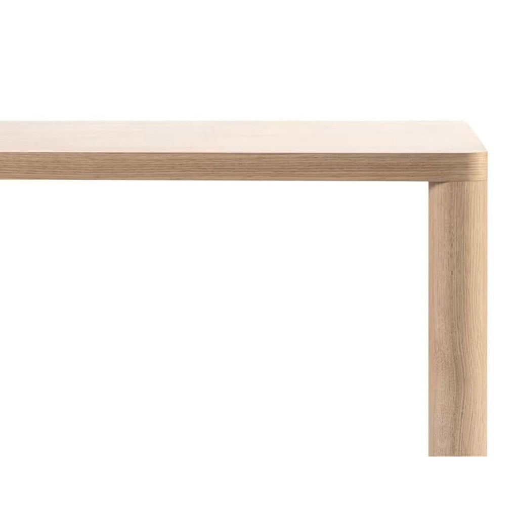 3. Side view of the HEM Log table highlighting the slim, light tabletop and sturdy, cylindrical oak legs.