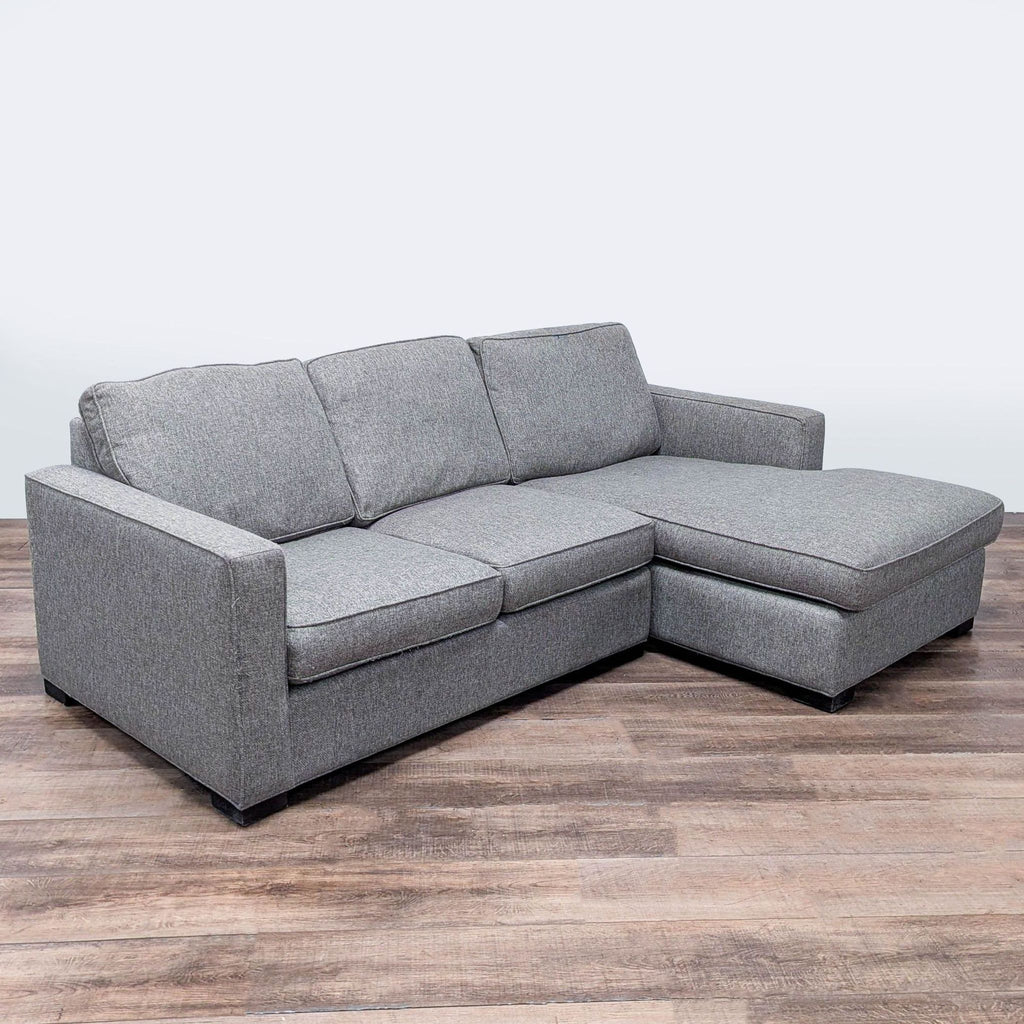 3. Room and Board sectional couch with wood block feet, deep chaise lounge, and supportive, cozy seating.