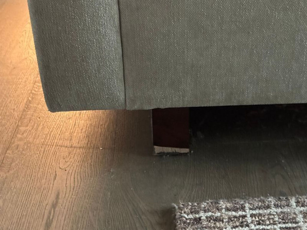 West Elm 3-seat sofa with modern, streamlined design in a neutral fabric.