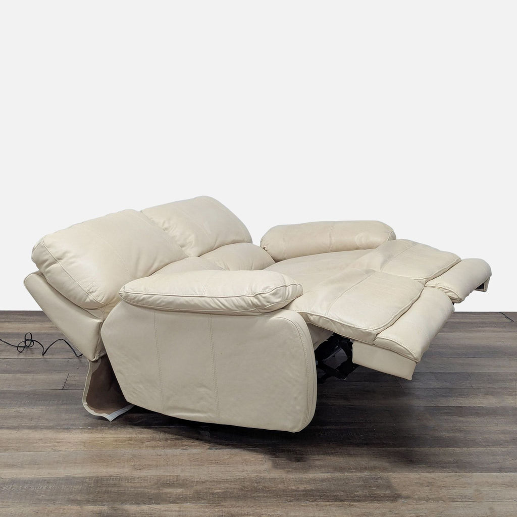 2. Side angle of Reperch Loveseat fully reclined, showcasing plush leather upholstery and relaxed seating.