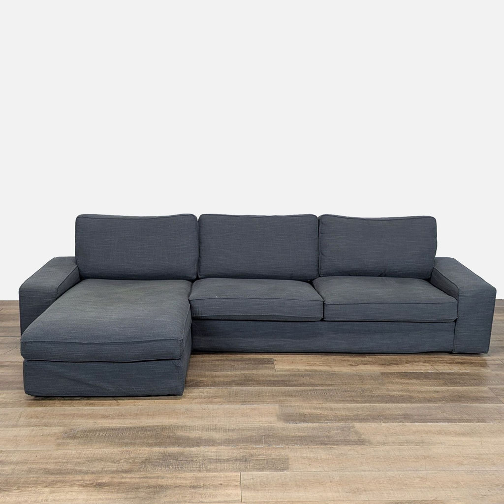 1. Dark gray Ikea sectional sofa with deep pocket-spring seats, wide track arms, and soft, supportive cushions.