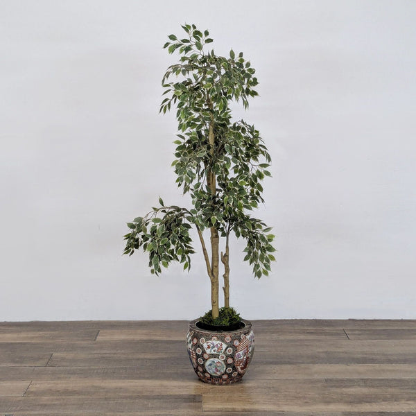 Potted artificial tree with variegated leaves in a decorative, Asian-inspired ceramic planter by Reperch.