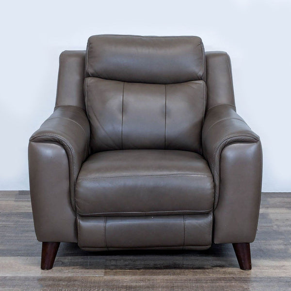 1. Brown leather Leggett & Platt lounge recliner chair, featuring plush cushions and wooden legs, front view.