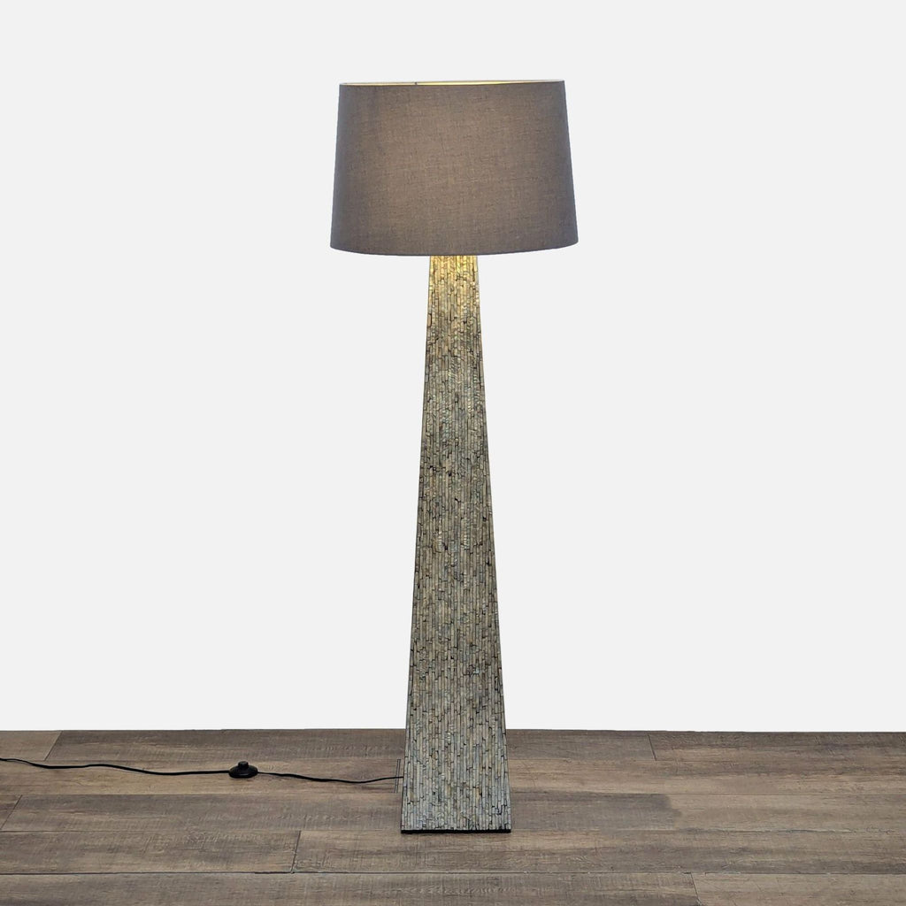 1. Floor lamp with a tall, tapered mosaic base and classic drum shade by Scandinavian Designs in Lighting.