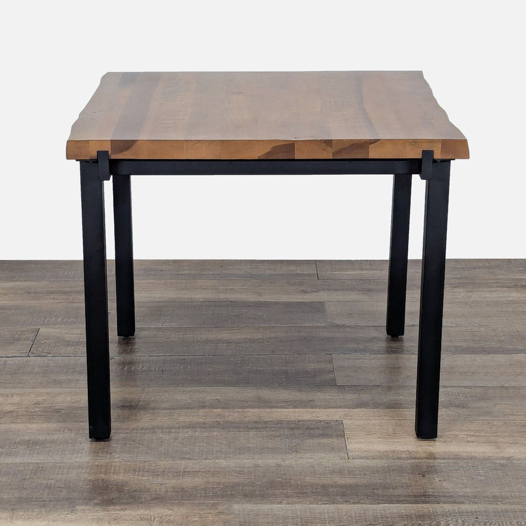 2. Modern square dining table featuring a solid American Poplar top and black powder-coated steel legs.
