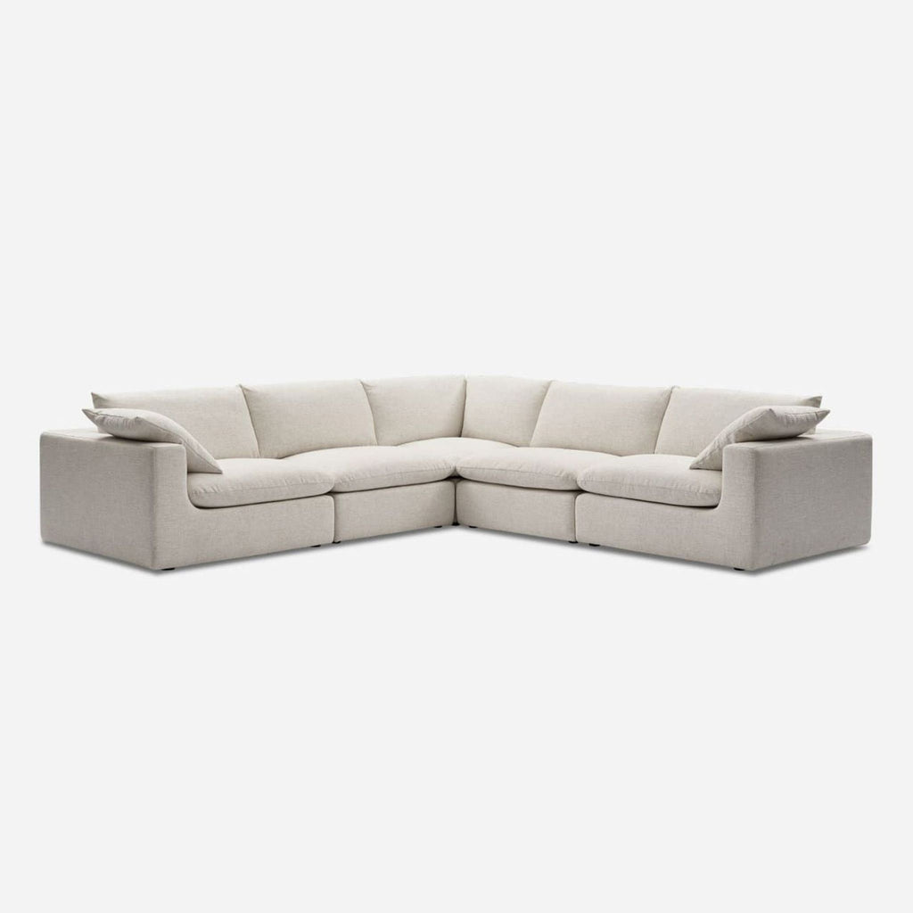 2. Contemporary Castlery sectional in Beach Linen with soft, feather-filled cushions, shown from an angled view.