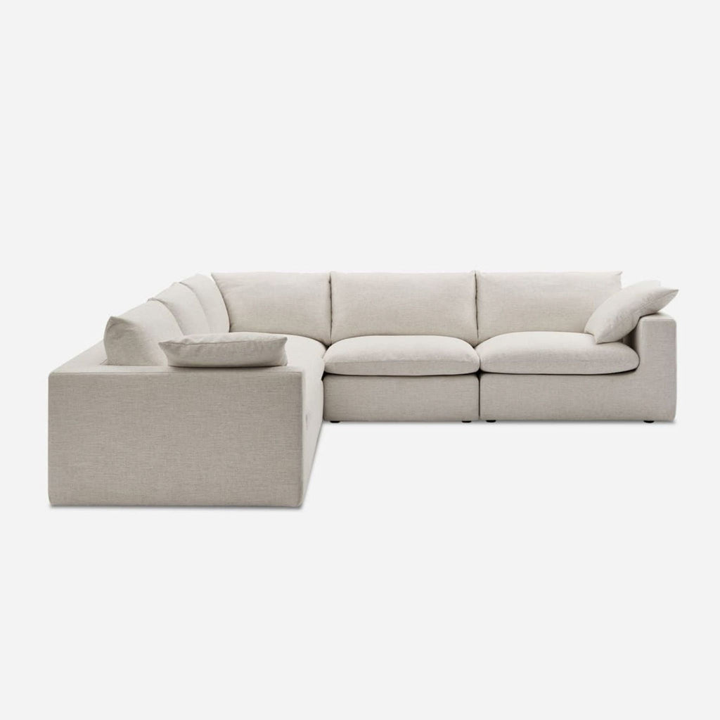 1. Castlery sectional sofa with light Beach Linen Upholstery and feather-filled cushions, airy and modern design.