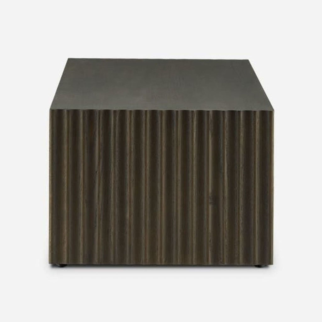 3. Side view of Castlery Sloane Coffee Table highlights fluted slab leg detail in a gray oak veneer finish.