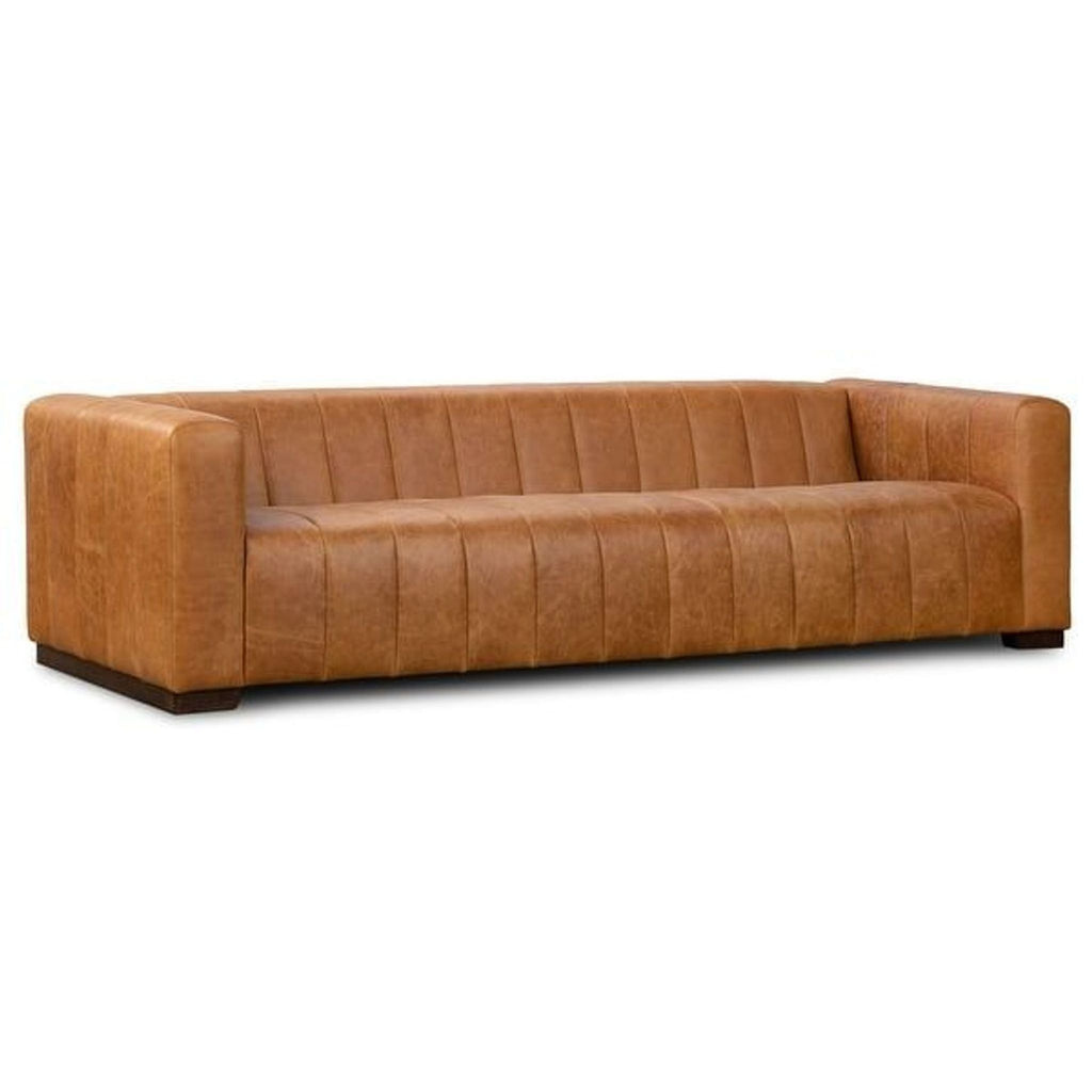 3. Angled view of the Canale 3-seat sofa by Poly & Bark with tan Italian leather and deep channel tufting.
