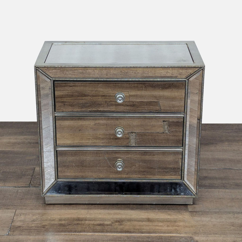 1. Z Gallerie end table with mirrored panels and silver leaf finish, featuring three drawers and decorative trim.  