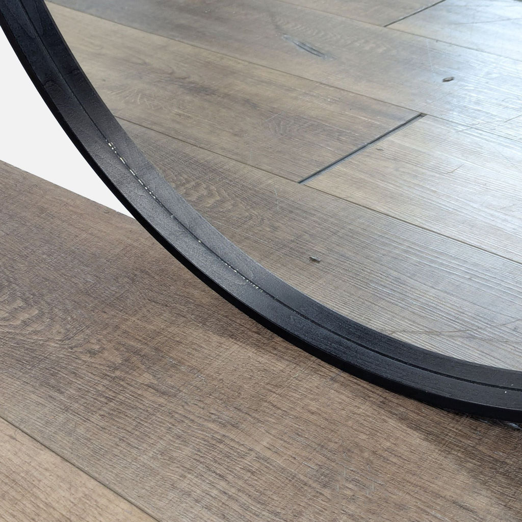 3. Close-up of EQ3 mirror's black frame, emphasizing smooth finish and construction details, Mirror category.