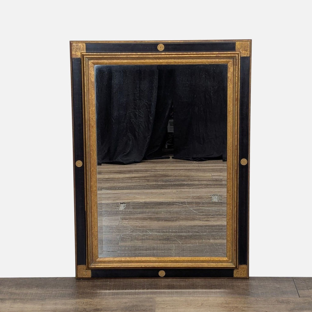 1. Rectangular Reperch mirror with a black and gold geometric frame featuring circular decorative accents.