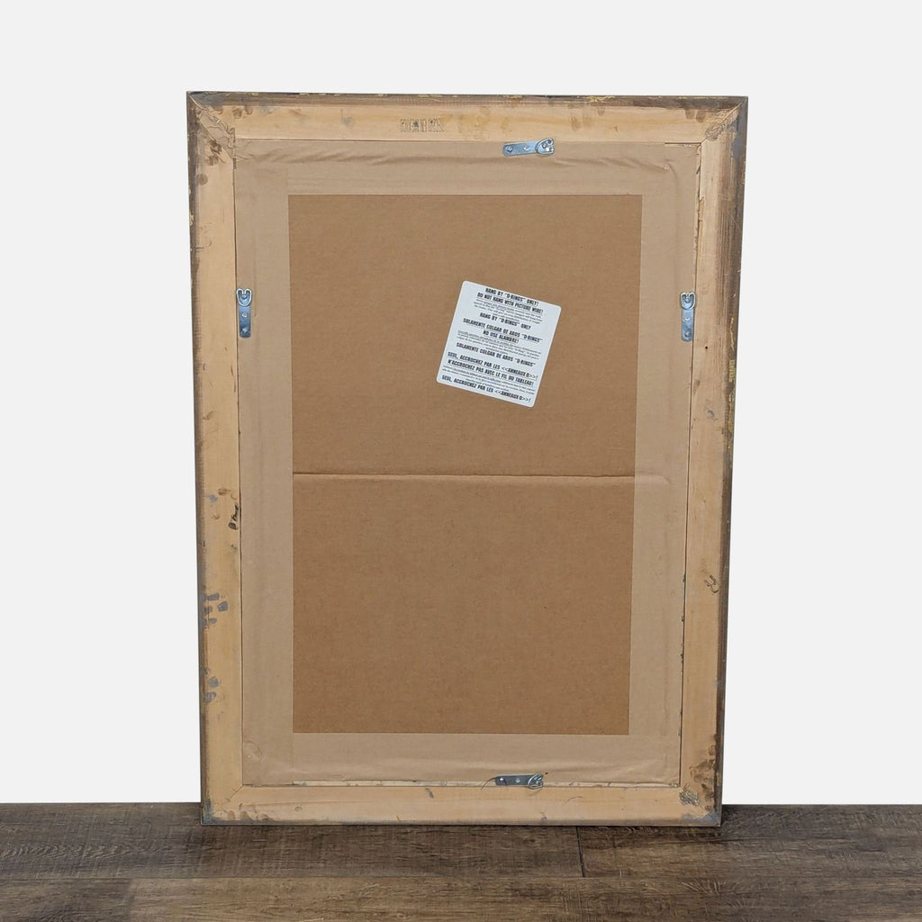 3. Full view of the back of a Reperch mirror featuring four mounting brackets and a central caution label.