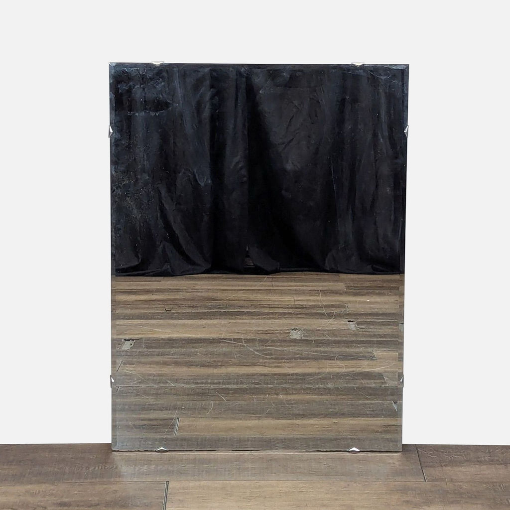 1. Rectangular Reperch mirror with beveled edges, reflecting a wooden floor and black curtain background.