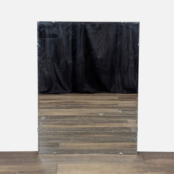 1. Rectangular Reperch mirror with beveled edges, reflecting a wooden floor and black curtain background.