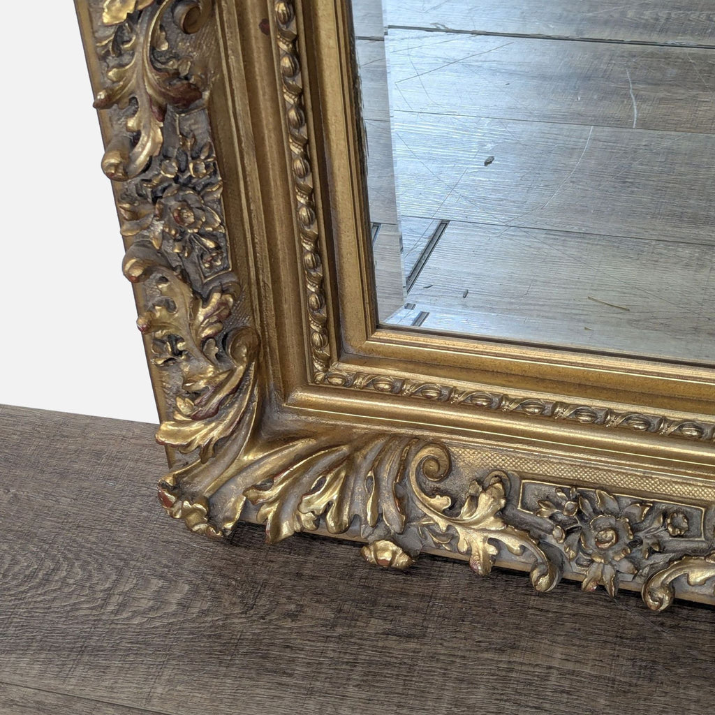 2. Close-up of the Reperch mirror’s detailed gold leaf floral framework, highlighting its texture and craftsmanship.