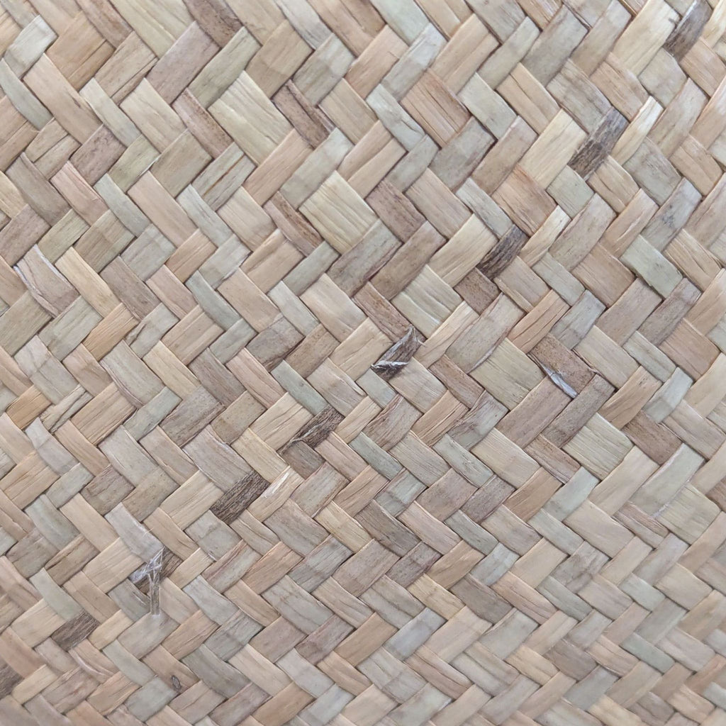 Detailed view of the natural woven seagrass texture used in Creative Co-Op baskets.