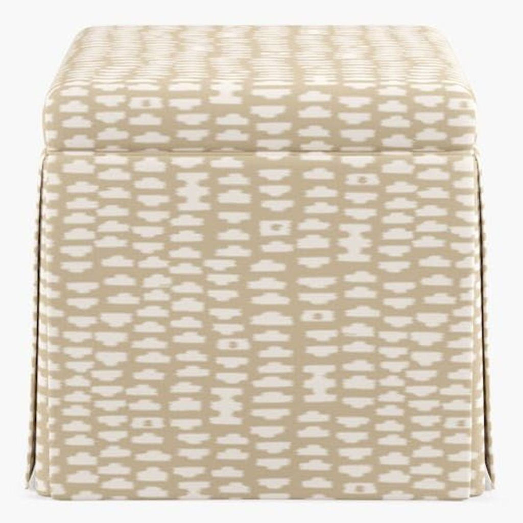 Front view of a Havenly ottoman in sand odalisque fabric, featuring a beige and white geometric pattern.