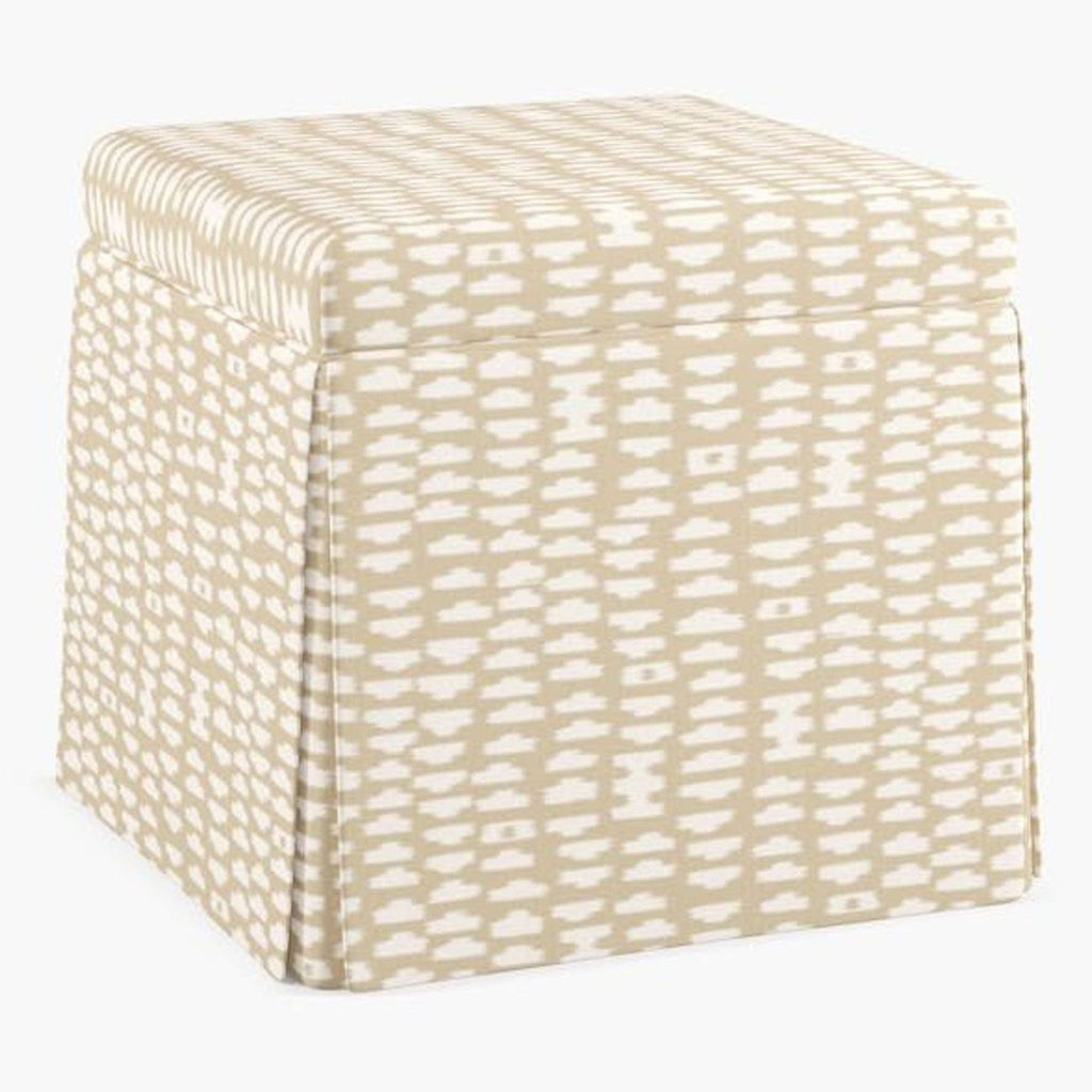 Beige and white patterned square ottoman with sand odalisque fabric by Havenly, shown at an angle.  
